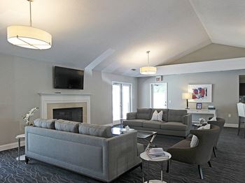 seating area with fireplace and TV at Wildewood South.